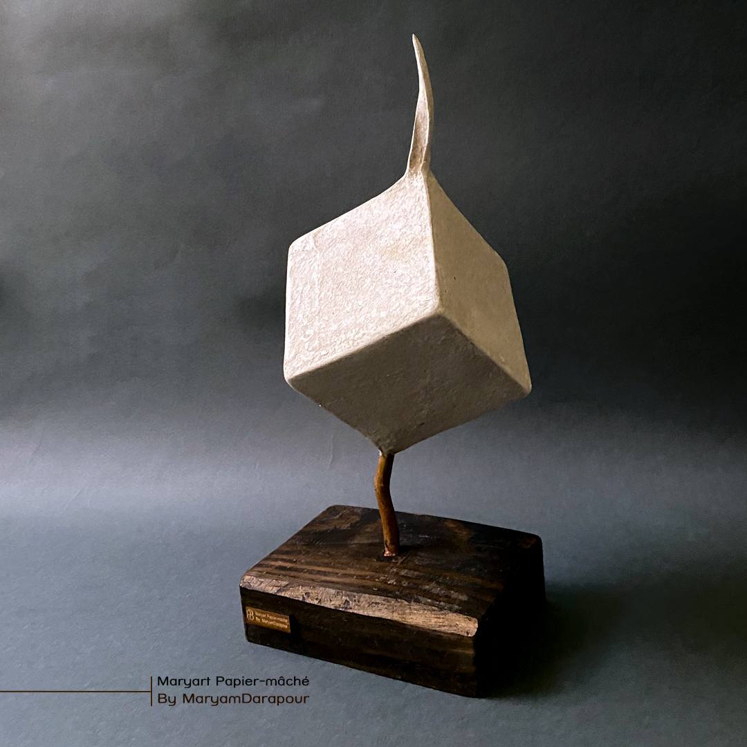 Balancing cube sculpture, studio photo
